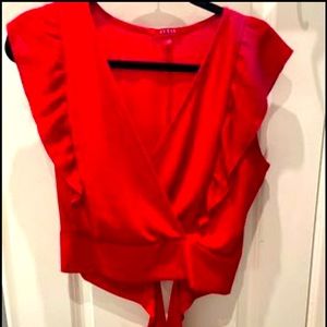 Tie back blouse in a stunning red. Long ties in the back to make a bow.